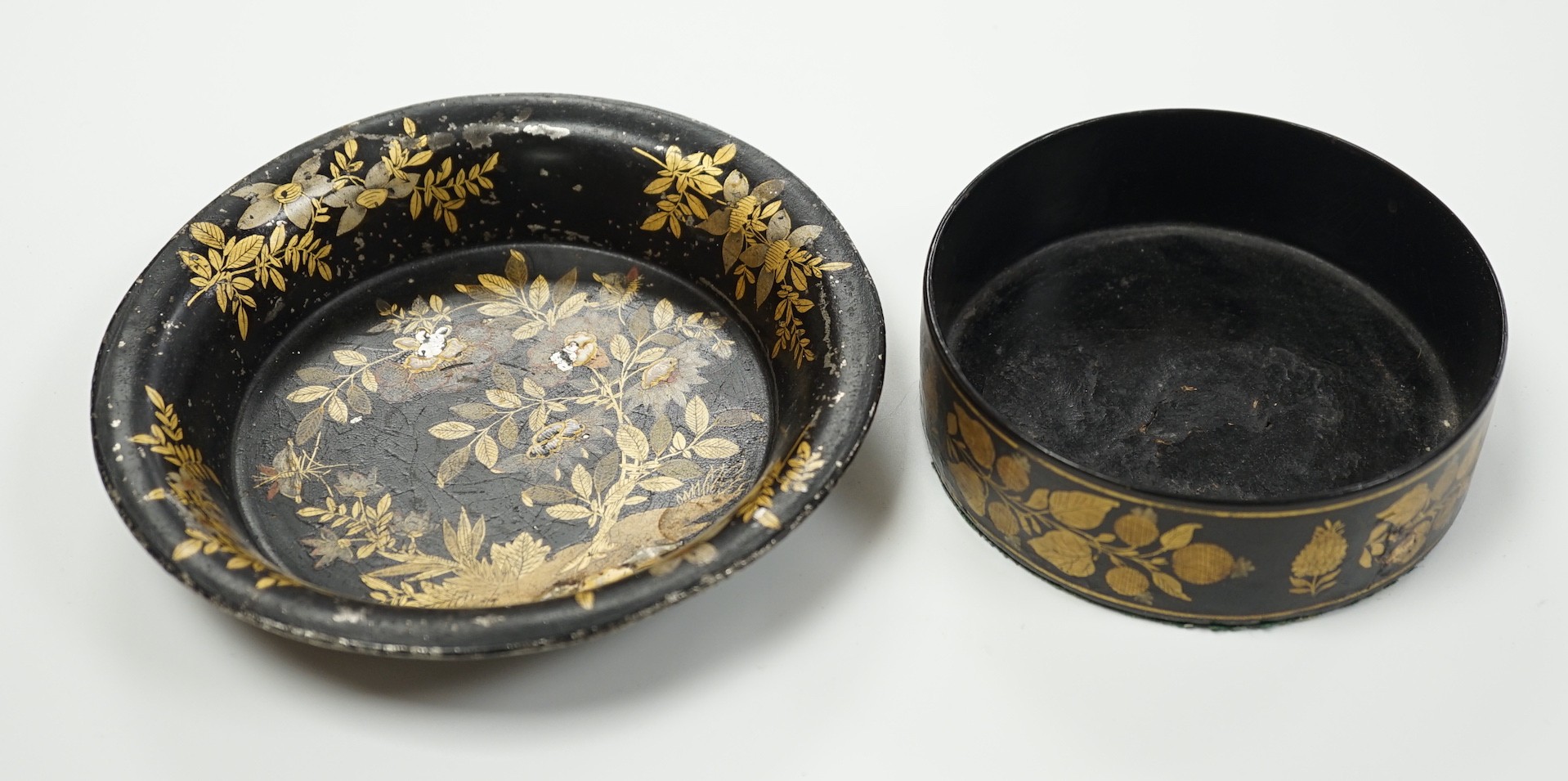 A Regency toleware coaster and a similar papier maché coaster, largest 16cm diameter